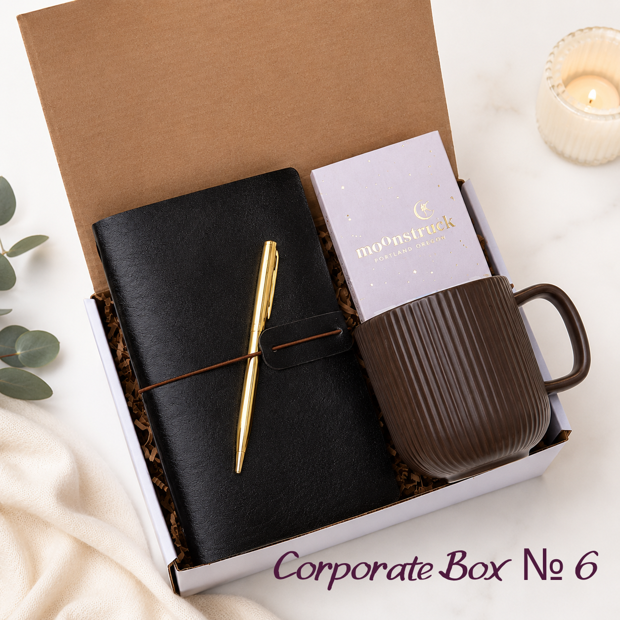 Corporate Gift Box No. 6 with black vegan-leather journal, gold pen, dark brown ribbed ceramic mug and Moonstruck chocolate bar