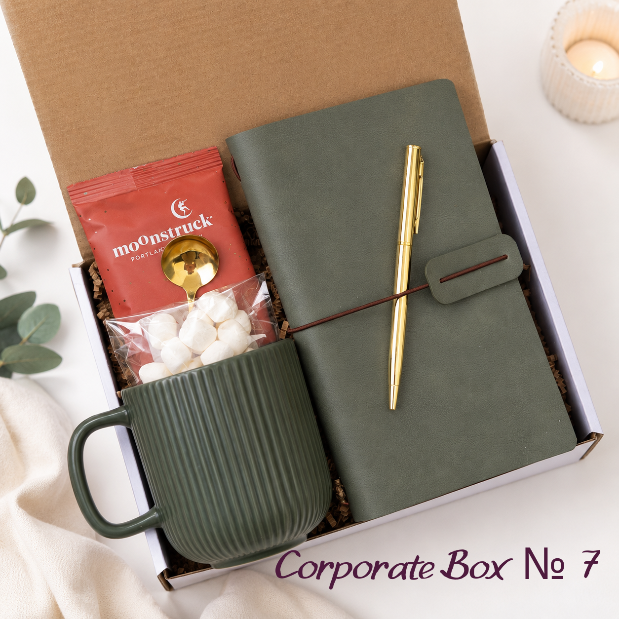 Corporate Gift Box No. 7 with olive journal, gold pen, green ribbed mug, Moonstruck hot cocoa, gold spoon and marshmallows
