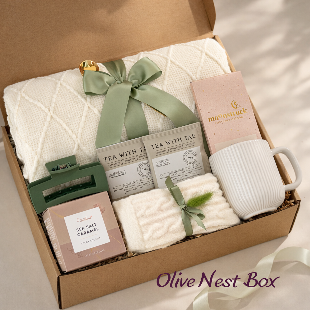 Olive Nest spa gift box with white blanket, artisan tea and ribbed ceramic mug in a kraft box